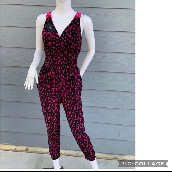 Pants - New Pink Women’s jumpsuit 
size 12
Sleeveless 
V neck style 
Stretchy waist